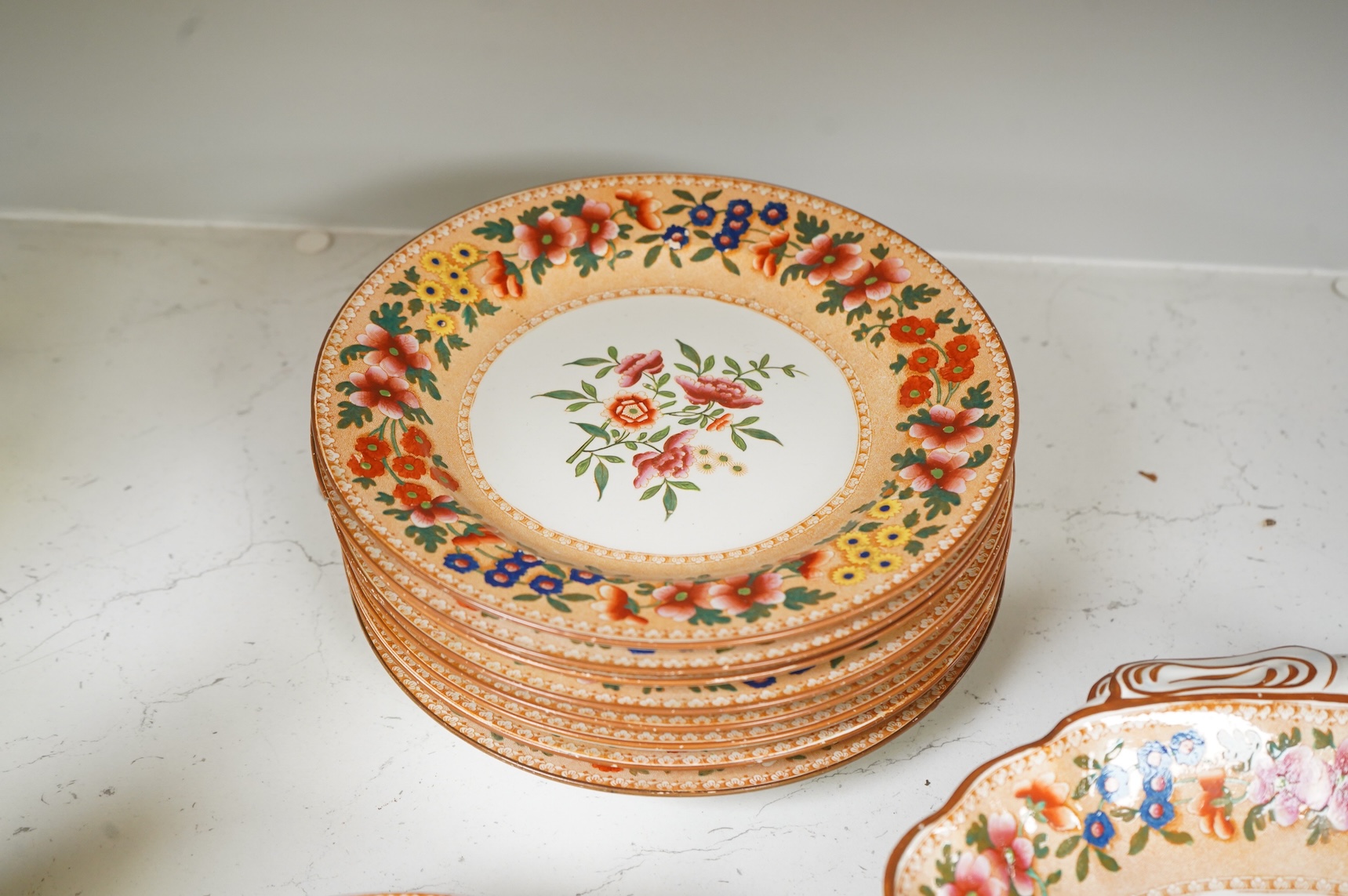 An early 19th century Spode printed and hand painted part dessert service, plates 20cm in diameter